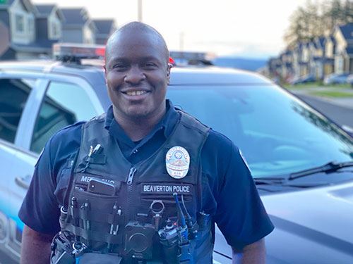 Officer standing and wearing a body worn camera