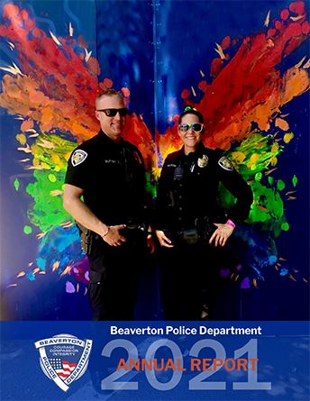 Report cover features two policemen link to 2021 Annual Report. Opens in new window