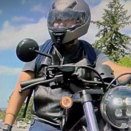 person wearing a helmet while sitting on a motorcycle