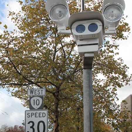 photo enforcement equipment near speed limit sign